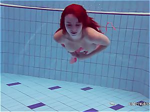 ginger-haired dancing in the pool