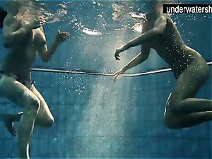 two wondrous amateurs showcasing their bodies off under water
